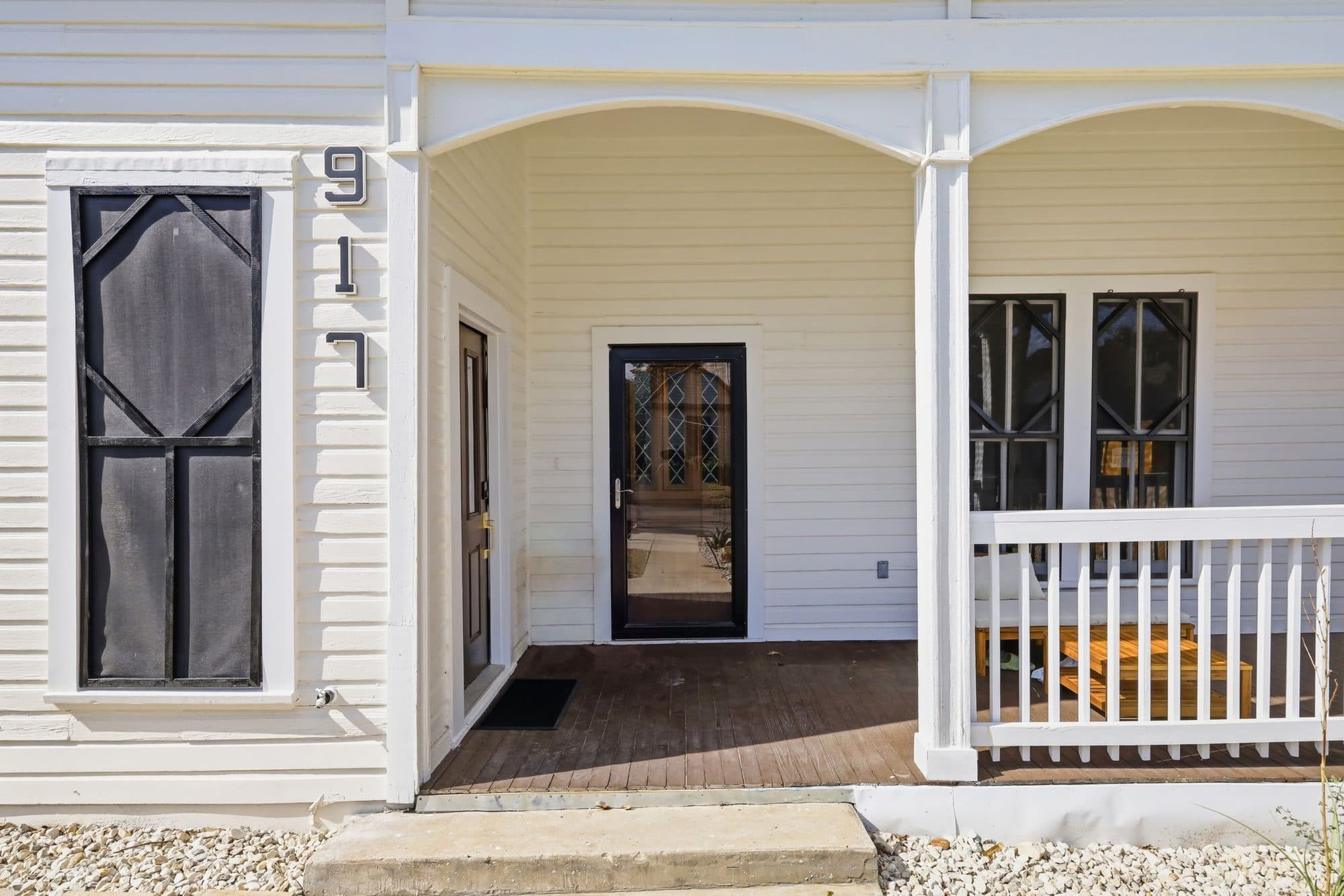 Restored front porch and original 917 house number at 917 Burnet Street