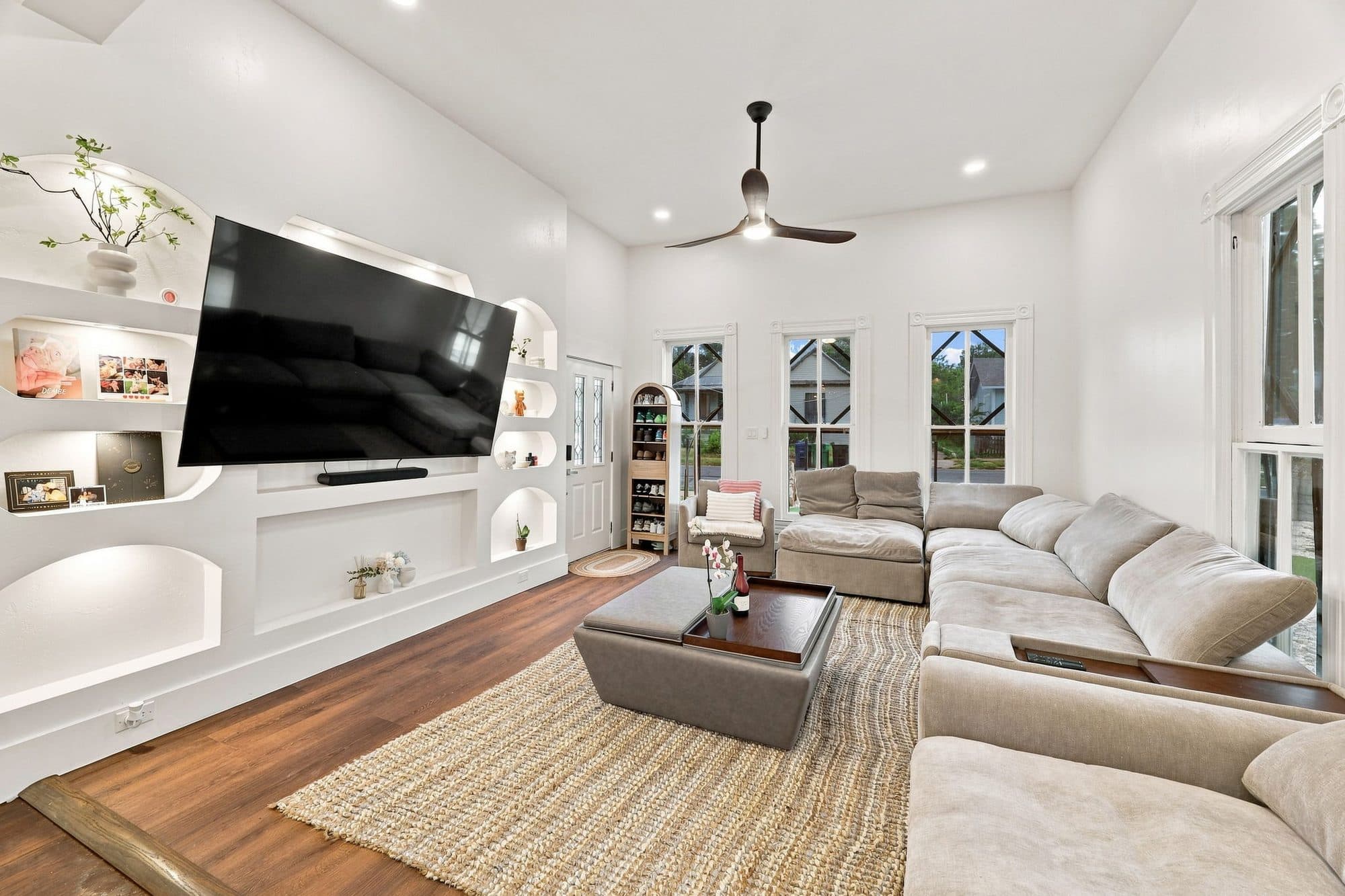 Open living room with built-in media wall at 917 Burnet Street