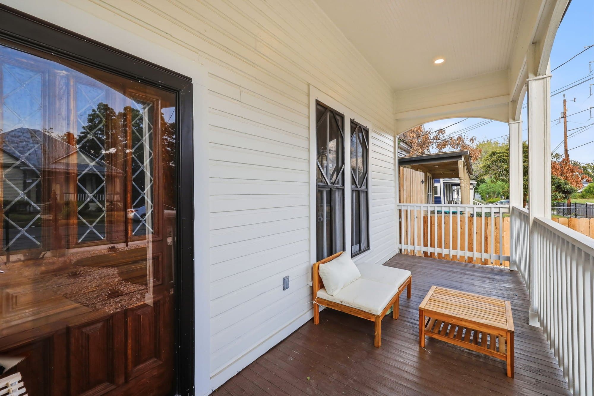 Wraparound front porch with bench seating and the original leaded-glass door, Dignowity Hill, San Antonio