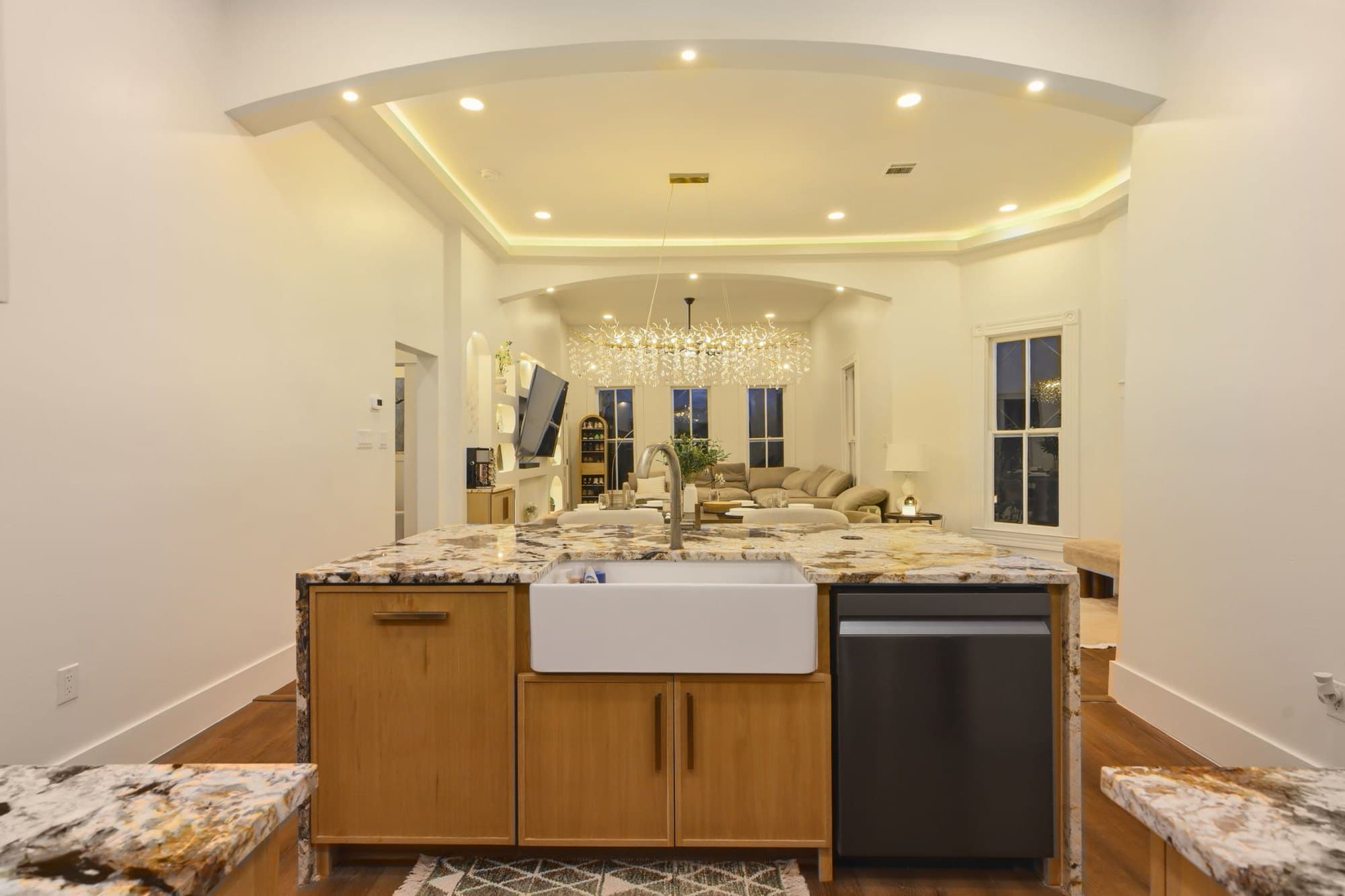 Kitchen island with farmhouse sink, range and custom oak cabinetry